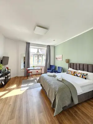 Ein Bett oder Betten in einem Zimmer der Unterkunft Exklusiv-Suite 10 min to Center