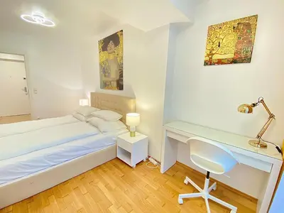 Ein Bett oder Betten in einem Zimmer der Unterkunft Pelikan Apartments