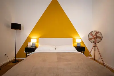 Ein Bett oder Betten in einem Zimmer der Unterkunft Central brand-new apartment with a patio