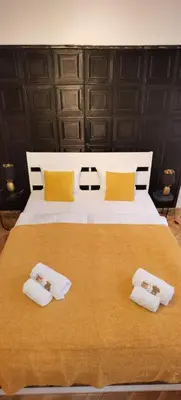 Ein Bett oder Betten in einem Zimmer der Unterkunft Dalia - Dolce Duo Homes