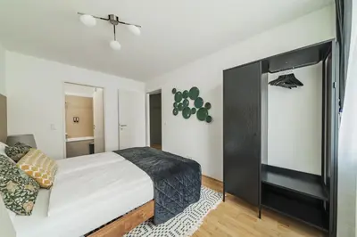 Ein Bett oder Betten in einem Zimmer der Unterkunft Modern Living Apartments Vienna, 15 min to center