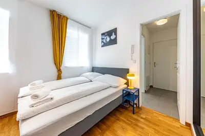 Ein Bett oder Betten in einem Zimmer der Unterkunft CALM & EASY by JR City Apartments