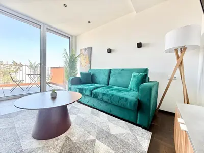 Ein Sitzbereich in der Unterkunft Penthouse Wien mit Parkplatz und Balkon