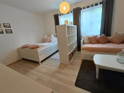 Ein Bett oder Betten in einem Zimmer der Unterkunft Ferienwohnung Strohblume