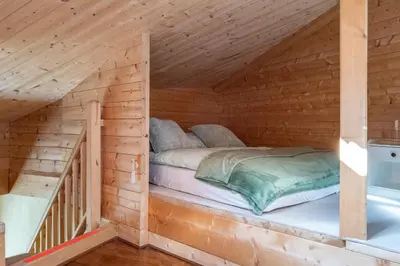 Ein Bett oder Betten in einem Zimmer der Unterkunft Strohlehm'zhaus