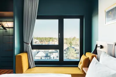 Ein Bett oder Betten in einem Zimmer der Unterkunft Hotel Schani UNO City