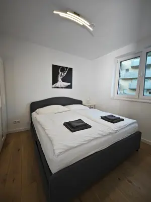 Ein Bett oder Betten in einem Zimmer der Unterkunft Cozy & Stylish Appartment in Vienna - 1 min to U3 Metro - Quiet Area with Shops nearby