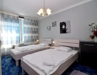 Ein Bett oder Betten in einem Zimmer der Unterkunft Cozy Apartment FREE parking