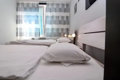 Ein Bett oder Betten in einem Zimmer der Unterkunft Cozy Apartment FREE parking