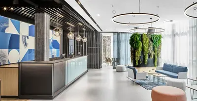 Ein Sitzbereich in der Unterkunft H2 Hotel Wien Schönbrunn
