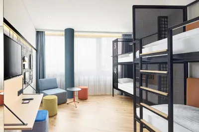 Ein Bett oder Betten in einem Zimmer der Unterkunft H2 Hotel Wien Schönbrunn
