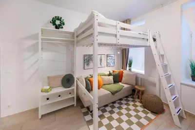 Ein Bett oder Betten in einem Zimmer der Unterkunft Market compact retreat