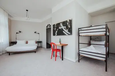Ein Bett oder Betten in einem Zimmer der Unterkunft Hotel Babula am Augarten