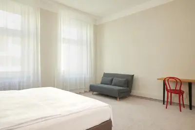 Ein Bett oder Betten in einem Zimmer der Unterkunft Hotel Babula am Augarten