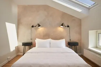 Ein Bett oder Betten in einem Zimmer der Unterkunft Hotel Babula am Augarten