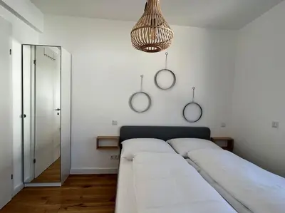 Ein Bett oder Betten in einem Zimmer der Unterkunft Modern Studio Gardenia_Gartenwohnung Alte Donau