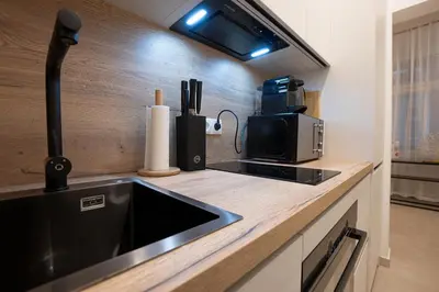 Küche/Küchenzeile in der Unterkunft Stylish central 1-bedroom apartment with a terrace