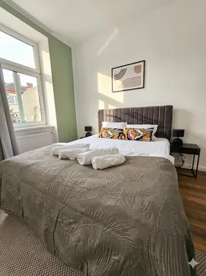 Ein Bett oder Betten in einem Zimmer der Unterkunft Cityline Suite 10 min to Center