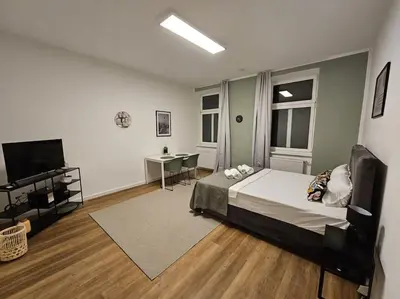 Ein Bett oder Betten in einem Zimmer der Unterkunft Cityline Suite 10 min to Center