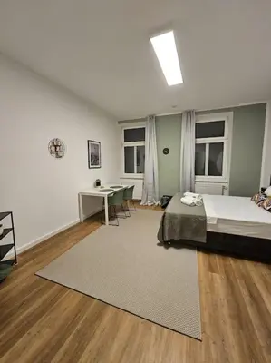 Ein Bett oder Betten in einem Zimmer der Unterkunft Cityline Suite 10 min to Center