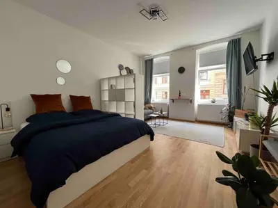 Ein Bett oder Betten in einem Zimmer der Unterkunft schickes & gemütliches Studio