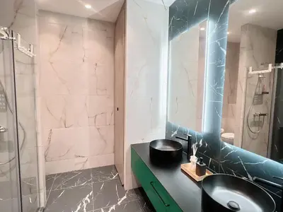 Ein Badezimmer in der Unterkunft Zeus Design Loft Apartments Braunhirschen