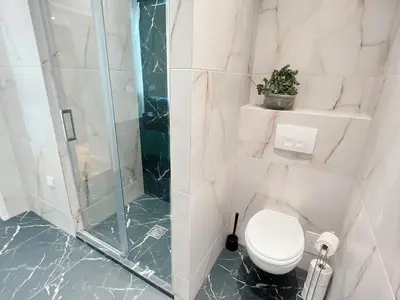 Ein Badezimmer in der Unterkunft Zeus Design Loft Apartments Braunhirschen