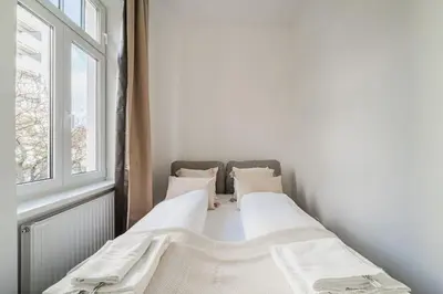 Ein Bett oder Betten in einem Zimmer der Unterkunft City Chic #18