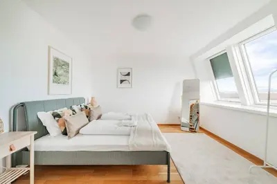 Ein Bett oder Betten in einem Zimmer der Unterkunft City Chic #21