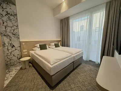 Ein Bett oder Betten in einem Zimmer der Unterkunft ARCOTEL AQ Wien