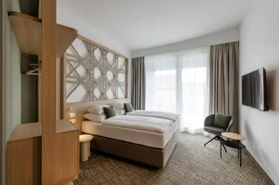 Ein Bett oder Betten in einem Zimmer der Unterkunft ARCOTEL AQ Wien