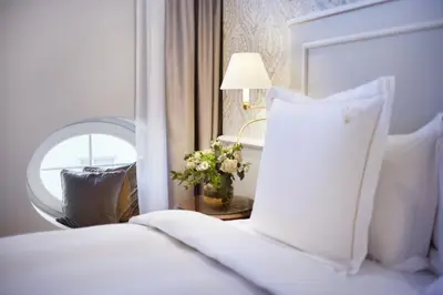 Ein Bett oder Betten in einem Zimmer der Unterkunft Hotel Zur Wiener Staatsoper