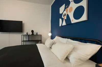 Ein Bett oder Betten in einem Zimmer der Unterkunft Modern apartment with a balcony near Belvedere
