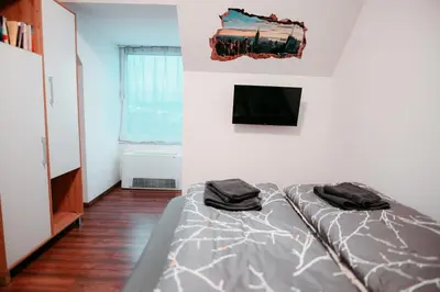 Ein Bett oder Betten in einem Zimmer der Unterkunft Vienna Shopping Center 12 Apartment
