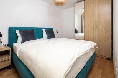 Ein Bett oder Betten in einem Zimmer der Unterkunft Zoder Apartments