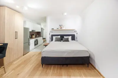 Ein Bett oder Betten in einem Zimmer der Unterkunft Zoder Apartments
