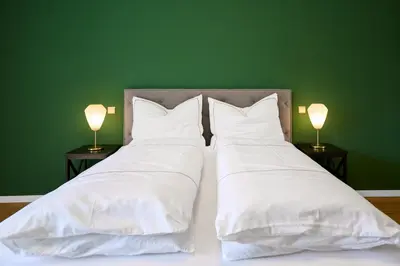 Ein Bett oder Betten in einem Zimmer der Unterkunft Altes Schloss - Boutique Ferienwohnung