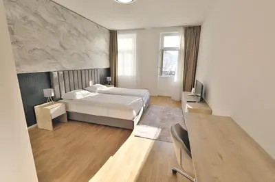 Ein Bett oder Betten in einem Zimmer der Unterkunft Vienna Lotus Apartments