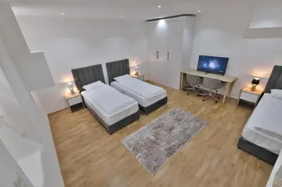 Ein Bett oder Betten in einem Zimmer der Unterkunft Vienna Lotus Apartments