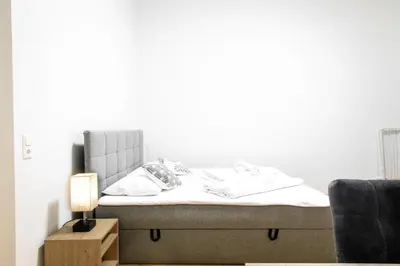 Ein Bett oder Betten in einem Zimmer der Unterkunft Royal-Haven Apartment