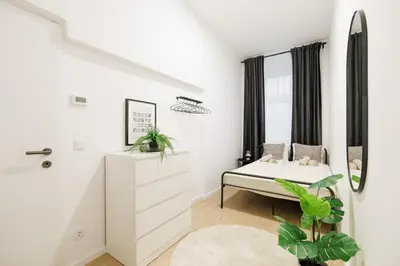 Ein Bett oder Betten in einem Zimmer der Unterkunft Central City Style Rooms by Home2