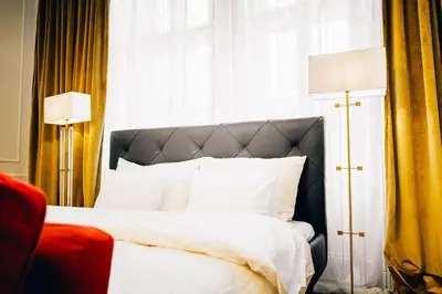 Ein Bett oder Betten in einem Zimmer der Unterkunft Royal Residence Schönbrunn