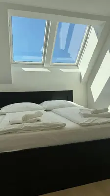 Ein Bett oder Betten in einem Zimmer der Unterkunft SI apartments - Smart Inn