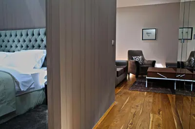 Ein Bett oder Betten in einem Zimmer der Unterkunft Vienna Suites