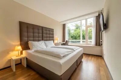 Ein Bett oder Betten in einem Zimmer der Unterkunft Pakat Residences