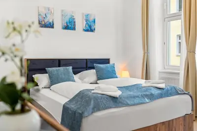 Ein Bett oder Betten in einem Zimmer der Unterkunft Traum-Wohnung, 63m², TOP Öffi-Anbindung, Smart-TV.