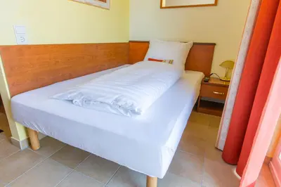 Ein Bett oder Betten in einem Zimmer der Unterkunft Hotel Elia