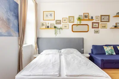 Ein Bett oder Betten in einem Zimmer der Unterkunft Gemütliche Wohnung nur 15 Minuten ins Stadtzentrum
