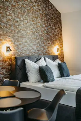Ein Bett oder Betten in einem Zimmer der Unterkunft Loft Schottenau