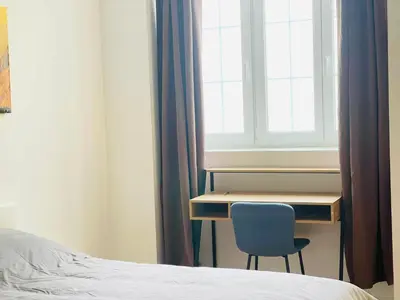 Ein Bett oder Betten in einem Zimmer der Unterkunft Sievering18 A-B